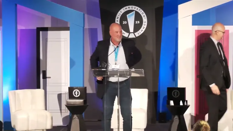 Position Imaging CEO Ned Hill accepting an award on stage at the 2023 Multifamily Innovation Summit
