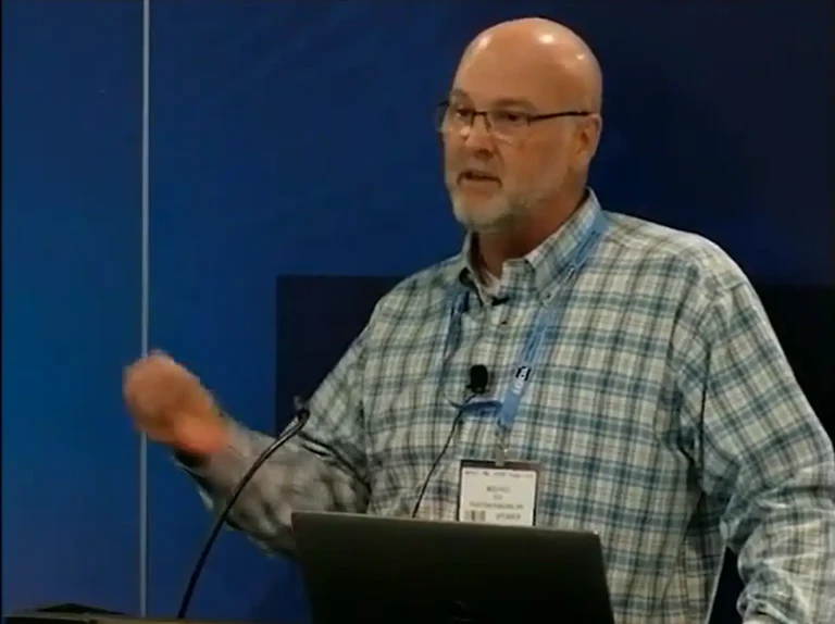 Ned Hill presenting at an industry conference